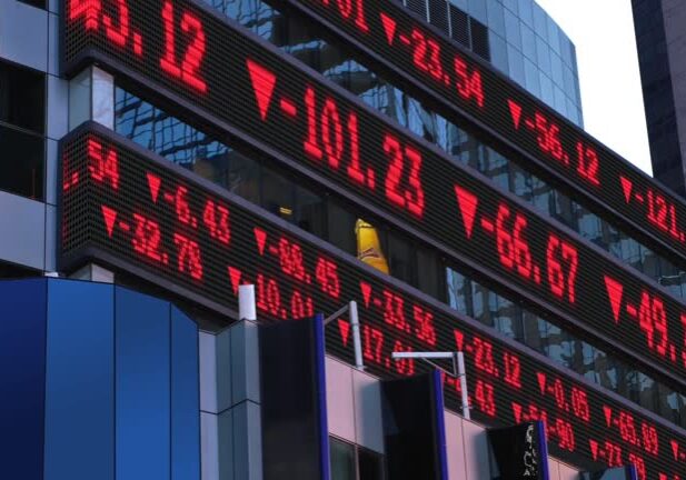 A view of a down stock market ticker. Numbers are fictional and do not represent any particular stock.